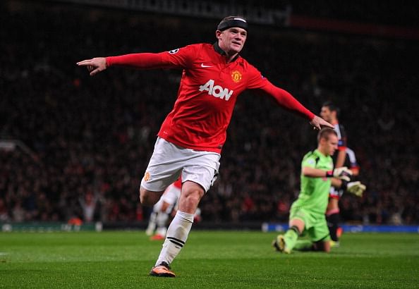 Wayne Rooney of Manchester United celebrates scoring his team's third goal during the UEFA Champions League Group A match between Manchester United and Bayer Leverkusen at Old Trafford on September 17, 2013 in Manchester, England. (Getty Images)